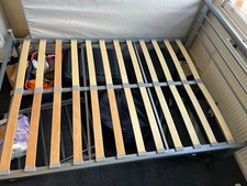 Metal bed frame with wooden sprung slats