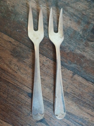 Two silverplated pickle - two, forks