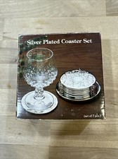 Silver Plated Coaster Set Singapore. On Stand. Orchid Design.