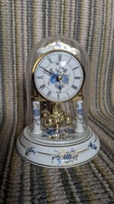 Mantle clock, porcelain with floral pattern. Howard Miller. Germany. Requires ad
