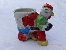 Vintage chicken Pulling Egg