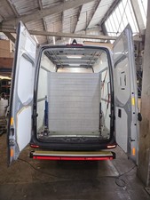 WM system Heavy Duty Aluminum van mounted loading ramp. Gas strut, folds away. 
