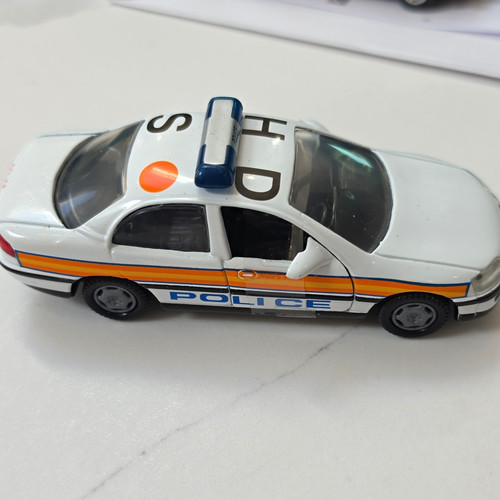 White diecast police model car - police,