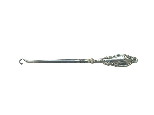 Antique button hook with solid - button,
