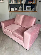 Pink two seater sofa. Brand
