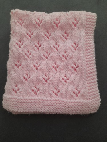 Hand knitted dolls pram cot - knitted,
