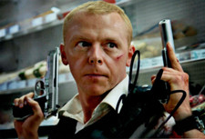 HOT FUZZ: SIMON PEGG 'SGT. NICHOLAS ANGEL'  SIGNED 6x4 ACTION PHOTO+COA