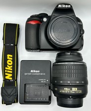 Nikon D3100 DSLR + 18-55mm VR Lens + Charger + Strap – 22k Shutter Count