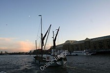 Photo 6x4 Passing Down River