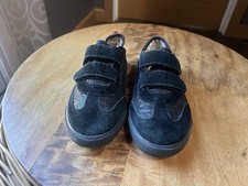 Black UGG sneaker-style shoes