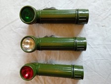 British Army right angle torches.All complete with 2 spare bulbs each enclosed