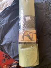 An unused foam yoga mat