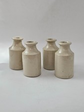 4 WHITE STONEWARE BOTTLES