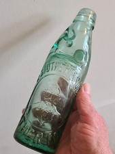 PICTORIAL 10OZ DARK AQUA CODD BOTTLE FROM ATHERTON IN VERY GOOD CONDITION.