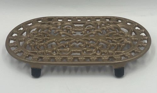 Vintage cast iron - trivet, gold