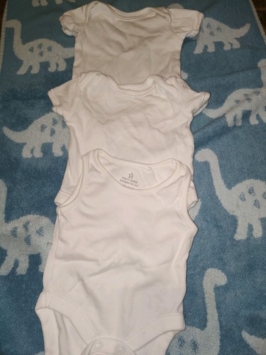 Tiny baby vests - baby,