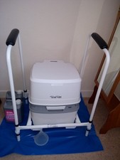 Used Thetford Porta Potti 165 portable toilet and a disability/mobility frame