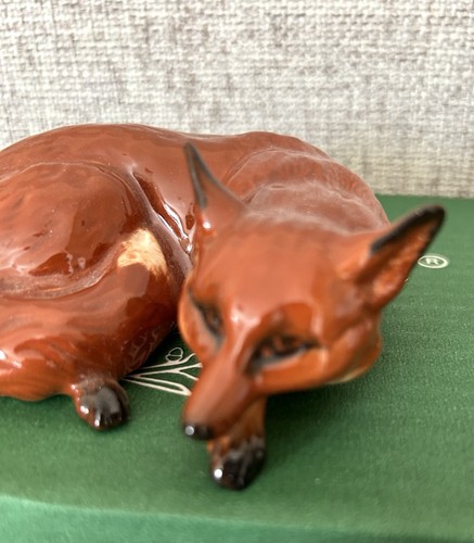 Beswick fox lying curled - lying,