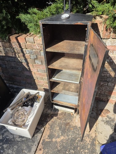 Tall fish smoker with - fish,