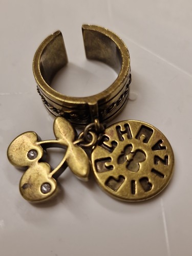 Gold toned open - open, by
