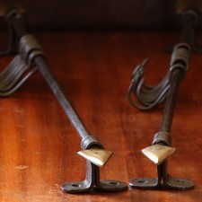 Pair or Hook Rails in the form of arrows, gilt bronze ends, ready to fit