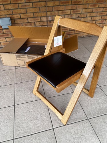 Four wooden folding - chairs,
