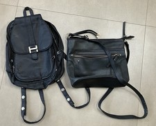 Two black bags. Salisburys and Peacocks Wipe clean. One size. Polyvinyl