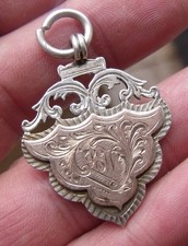 ANTIQUE STERLING SILVER & GOLD WEALDSTONE TRADEMENS CUP 1904 FOOTBALL MEDAL.