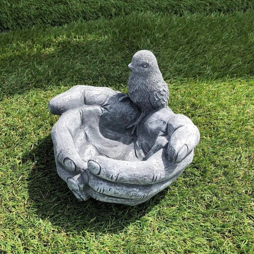 Small bird hand concrete - hand,
