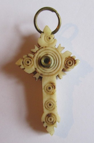 Small carved bone cross with - small,