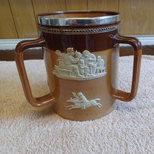 ROYAL DOULTON STONEWARE.THREE-HANDLE LOVING CUP WITH SILVER RIM. WITH FAULTS.