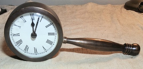 Heavy brass clock with - clock, handle