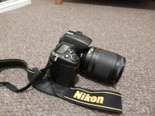 nikon d7000 camera with af-s dx 18-105mm ed lens and a af-s dx 55-mm ed lens