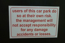 Car Park sign Park At Own Risk