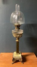 A Victorian Hinks and Sons brass, glass and marble oil lamp