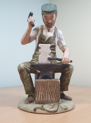 Blacksmith with hammer anvil - with,