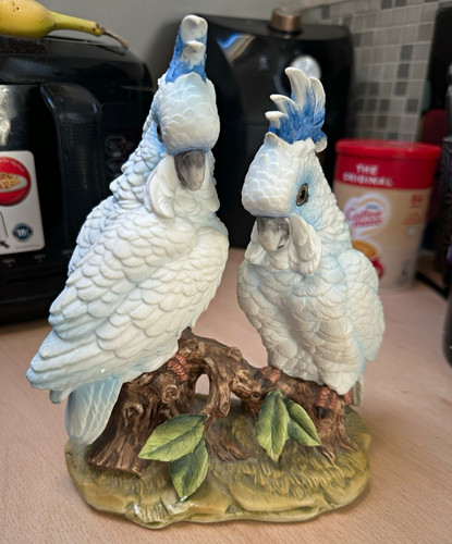 Two white blue painted resin - &,