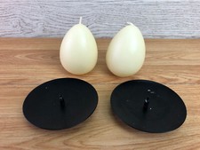 2 Egg Shaped Candles With Black Metal Spike Candle Holders