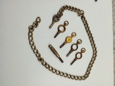 A Collection Of 6 Antique Pocket Watch Keys Various Sizes Victorian And A Chain