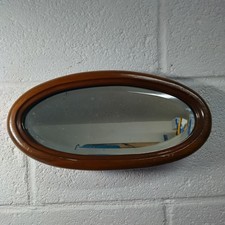 Antique wooden framed oval bevelled edge mirror small
