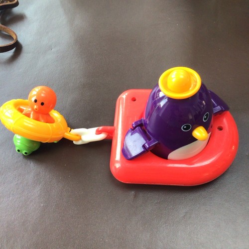 Vintage penguin floating boat - vintage,