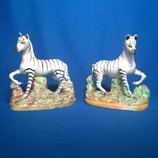 Pair of 19th Century Staffordshire Models of Zebras on Naturalistic Bases c.1860