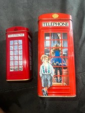 Two red telephone money boxes vintage