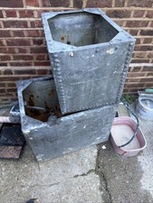 Pair of vintage galvanised riveted water tanks