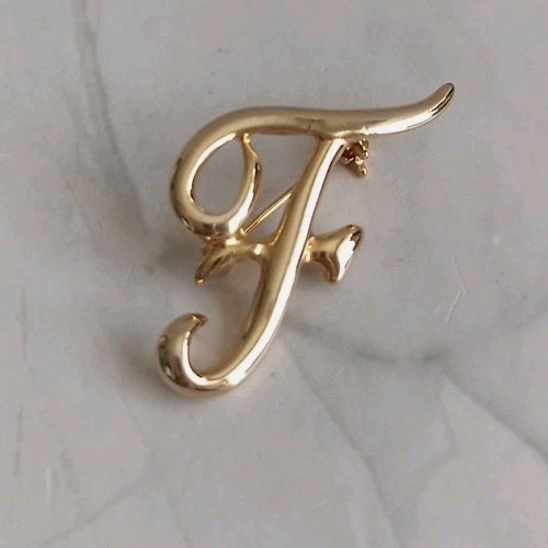 Gold tone letter brooch - f,