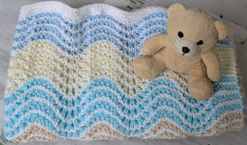 Hand crafted knitted baby - hand,