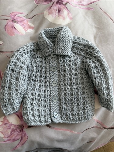 Hand knitted baby boy - hand,