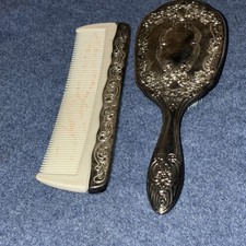 silver colored vintage brush