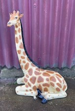 Small sitting giraffe figure /