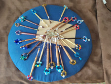 VINTAGE LACE MAKING CUSHION AND WOOD SPANGLED BOBBINS IN-SITU